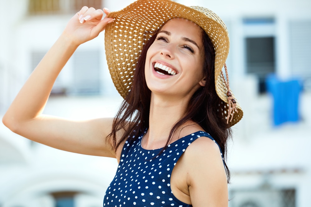 Portrait,Of,A,Beautiful,Woman,In,A,Straw,Hat.,Laughing 1757703825 7dbc6d0ad0ba424e83fa064c3adf2da4 1