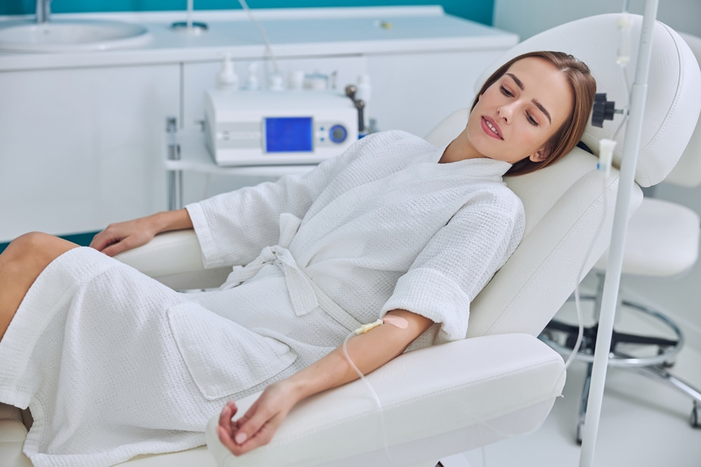 Redheaded,Beautiful,Female,Resting,And,Getting,Iv,Infusion,In,Spa IV Therapy Milledgeville GA