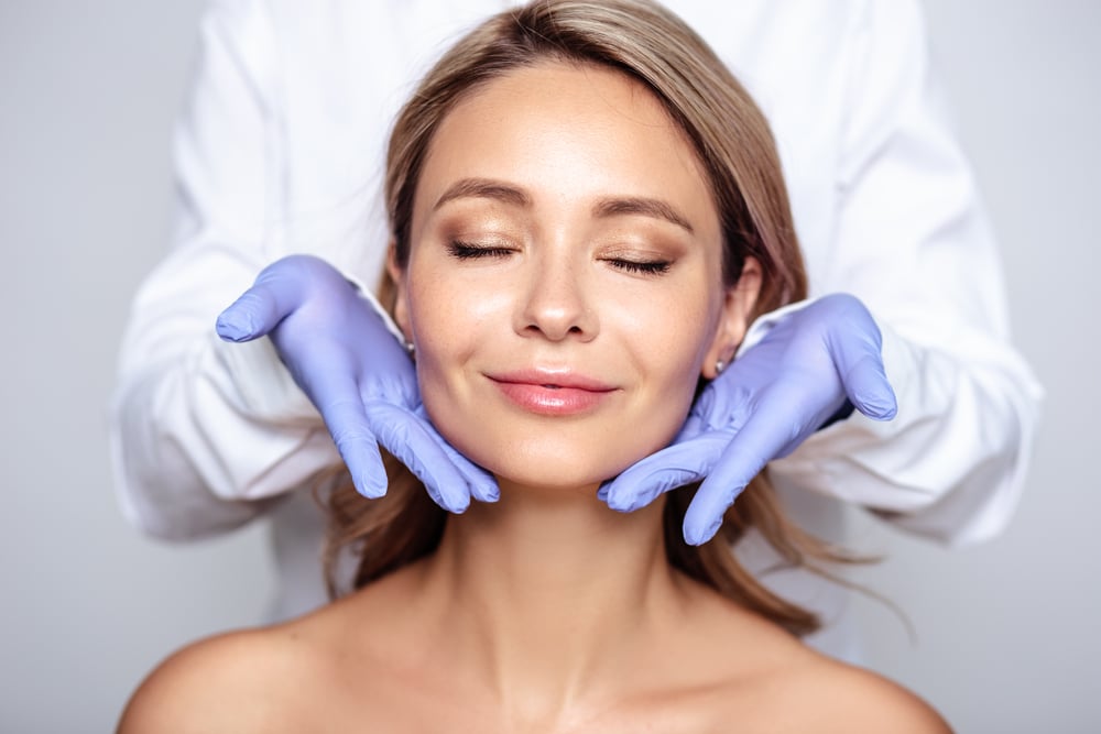 Close,Up,Portrait,Of,Young,Blonde,Woman,With,Cosmetologyst,Hands Laser Hyperpigmentation Removal Milledgeville GA