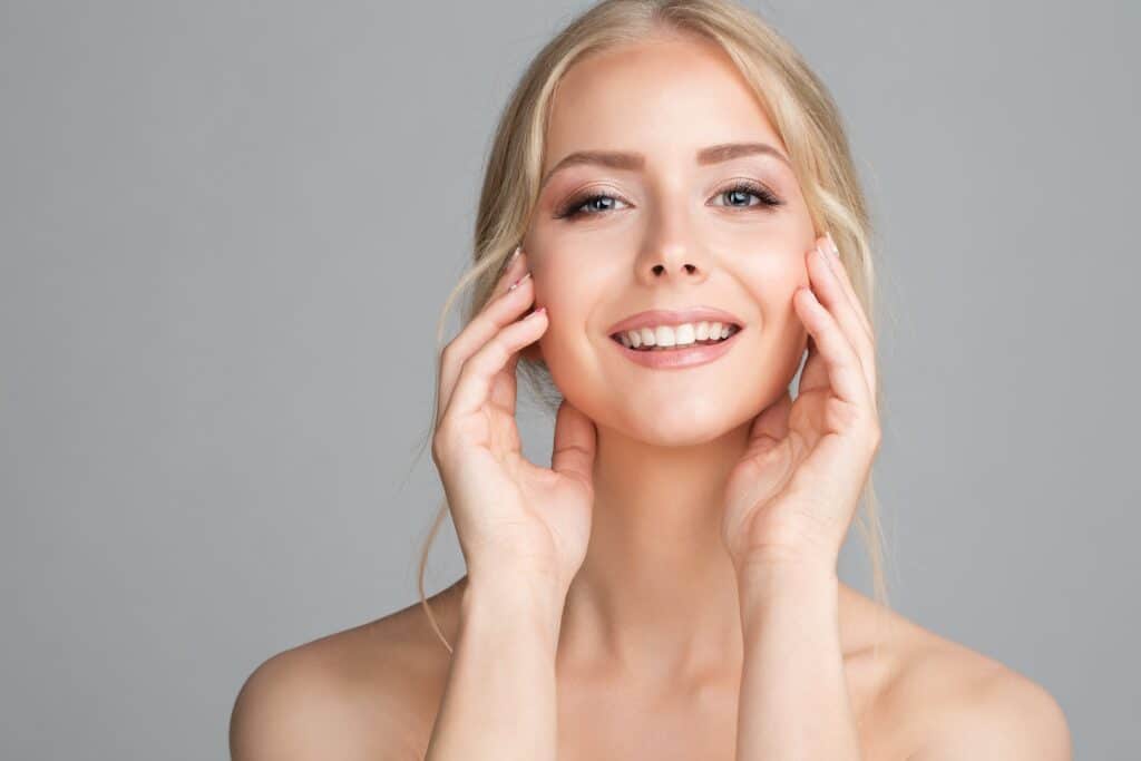 Cheerful,Smiling,Young,Woman,Massaging,Face,Cheek,Bones.,Beauty,Model Hydrafacial Milledgeville GA
