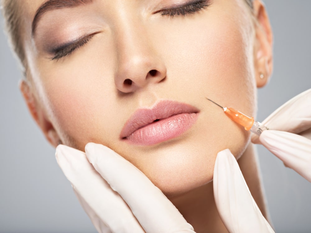 Woman,Getting,Cosmetic,Injection,Of,Botox,In,Cheek,,Closeup.,Woman Restylane Milledgeville GA